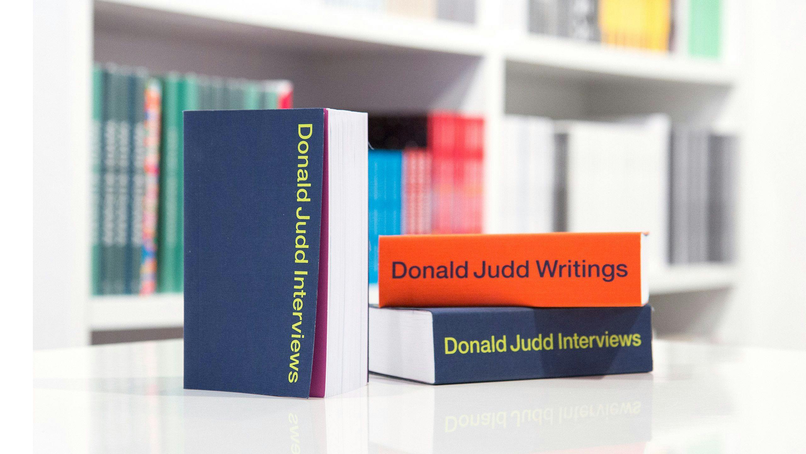 Cover of a book titled Donald Judd Interviews and a book titled Donald Judd Writings, published by David Zwirner Books in 2019.